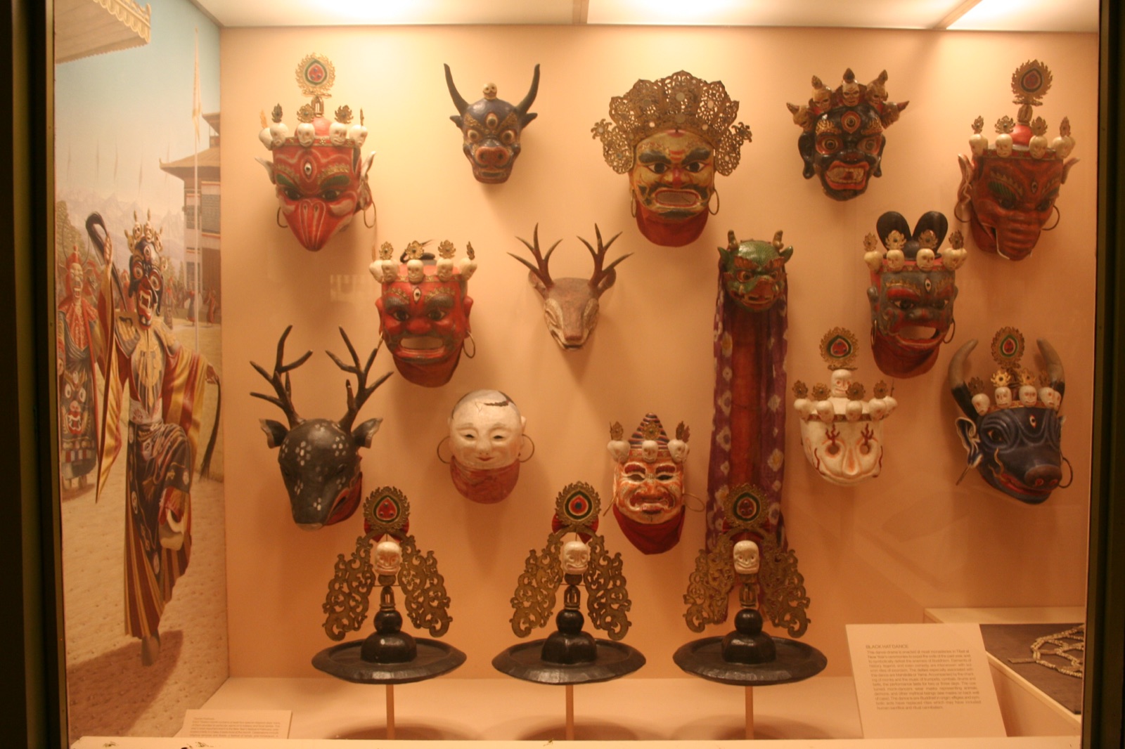 Display case at the American Museum of Natural History showing Tibetan Cham masks in the Hall of Asian Peoples.